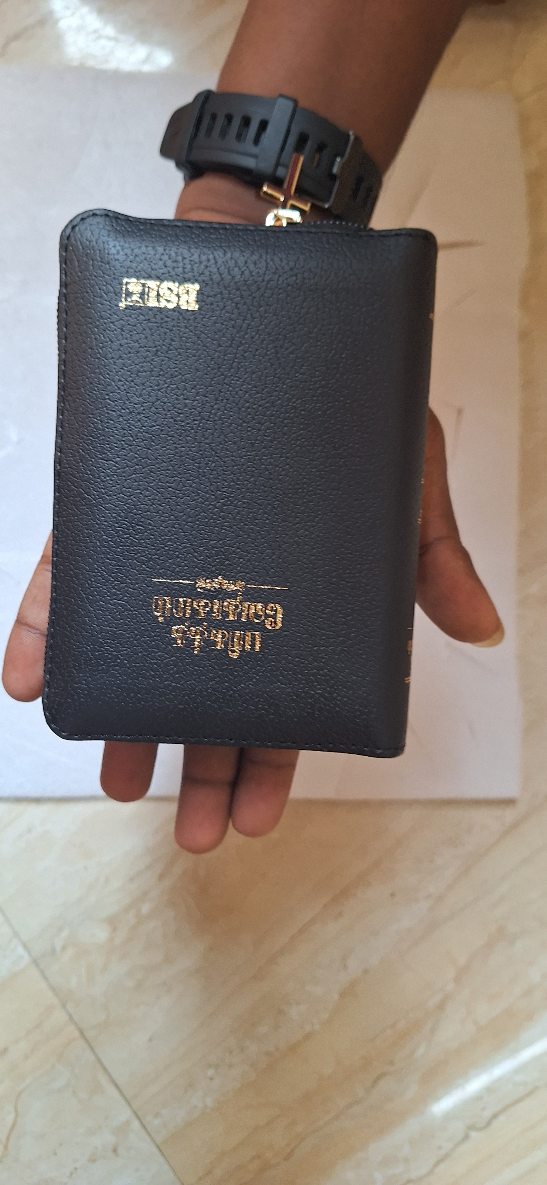 Close-up of Tamil Holy Bible with golden edge and zip pocket