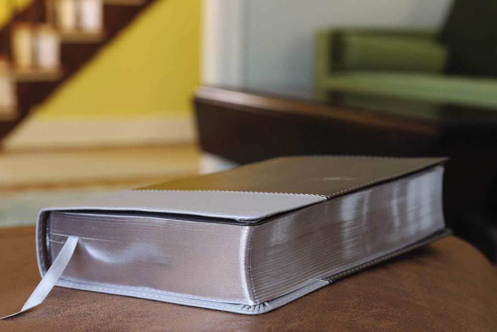 NIV Couples' Devotional Bible, Italian Duo-Tone, Chocolate/Silver, photographed from an angle.