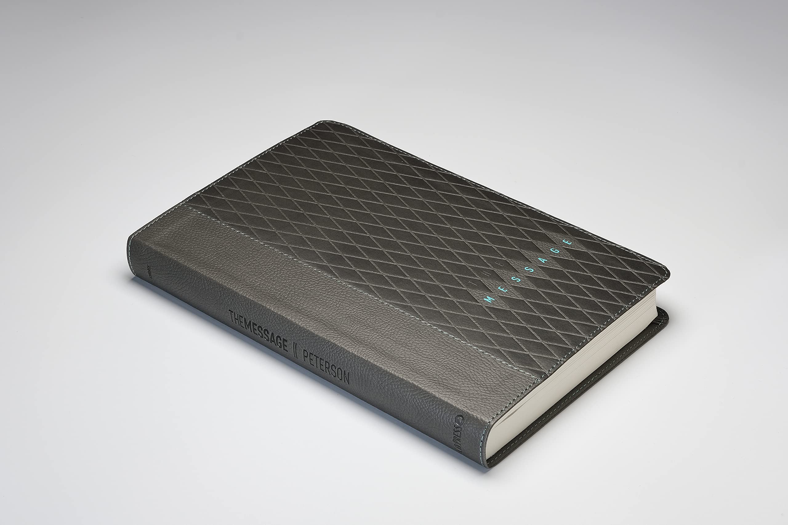The Message Slimline Bible, a slimline edition in charcoal diamond leather-look leather bound.