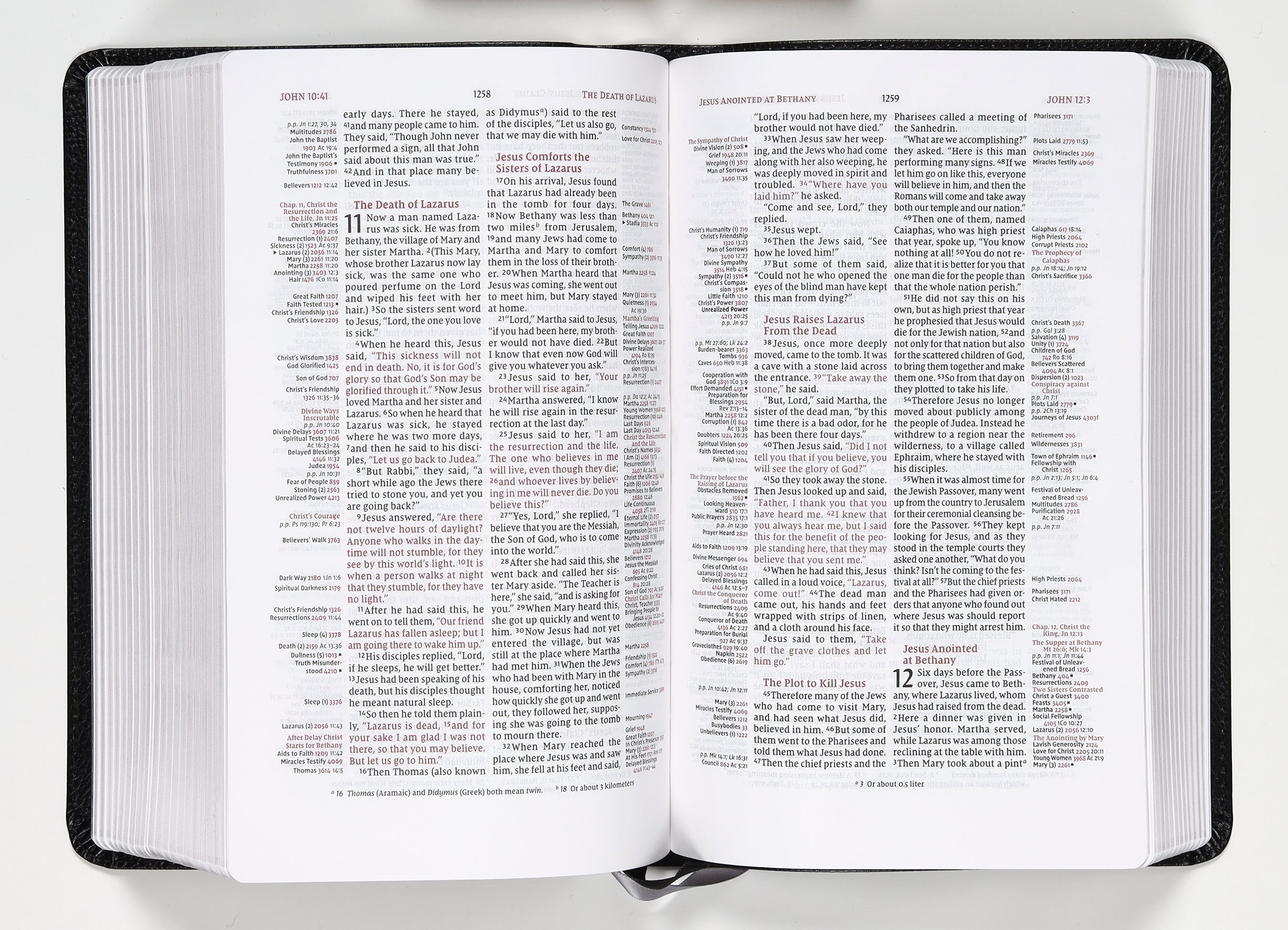 NIV Thomson Chain-Reference Bible in handy size black with red letter edition on a flat surface