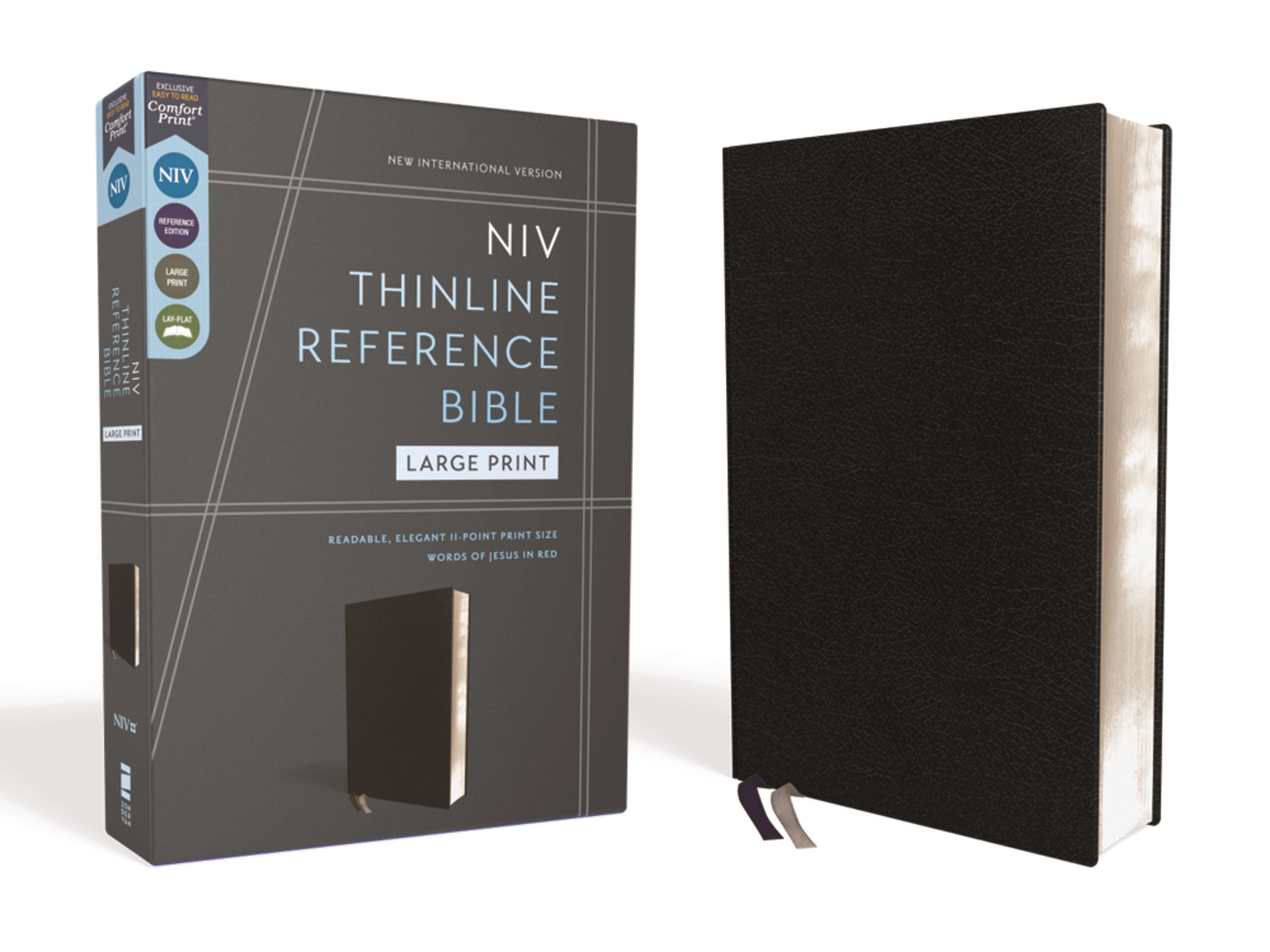 NIV Thinline Reference Bible large print black with red letter edition on a desk or table