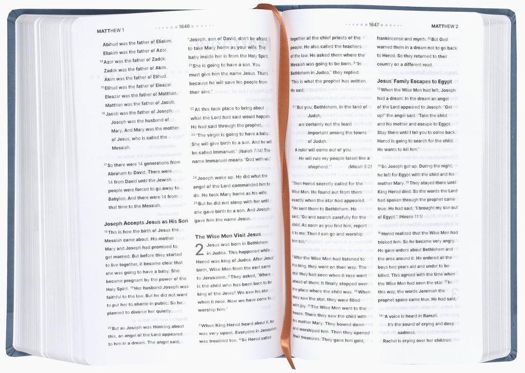 Open pages of the NIRV Clear Focus Bible for Kids, Blue, showing engaging stories and lessons