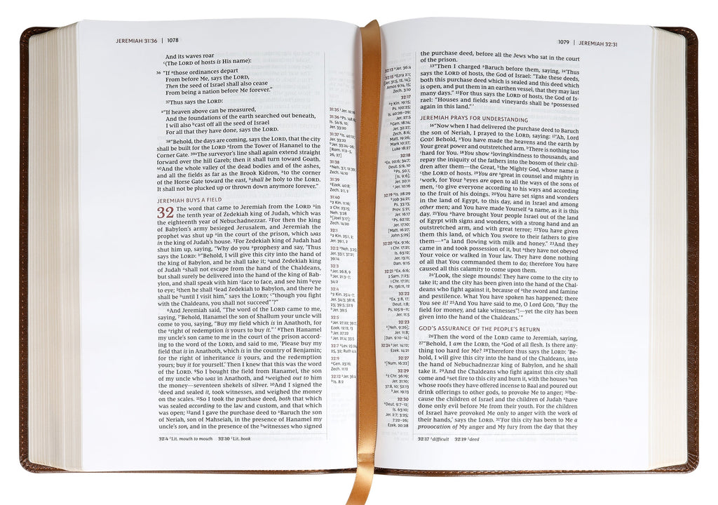 NKJV Single-Column Wide-Margin Reference Bible open to a Bible verse in Brown leather cover with Red Letter Edition
