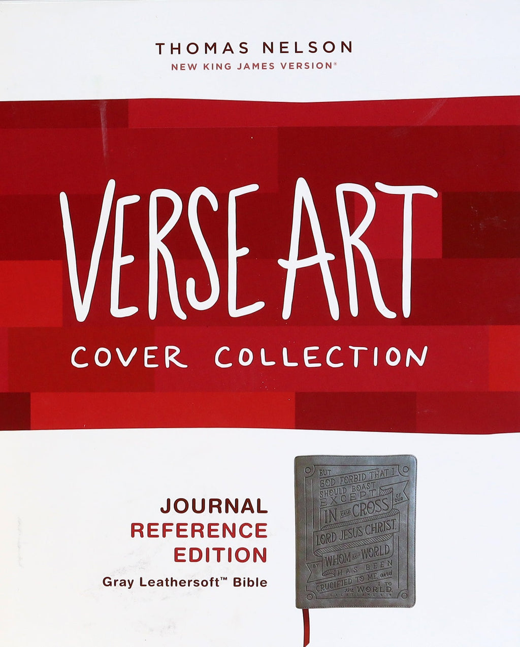 NKJV Journal Reference Bible Red Letter Edition with Verse Art Cover on a table