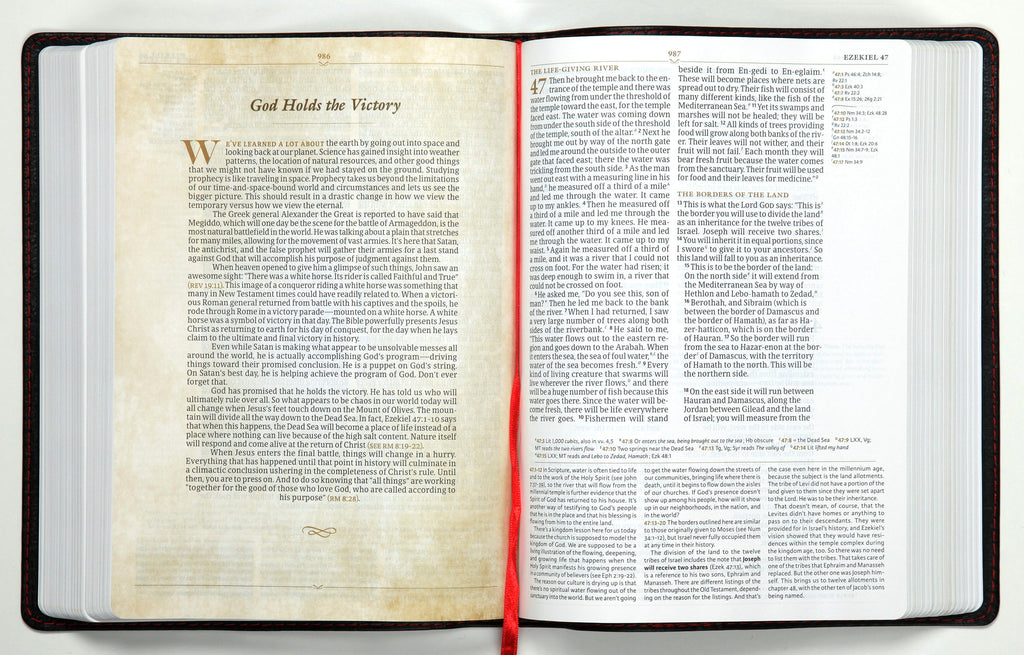 CSB Tony Evans Study Bible Black (Black Letter Edition) on a luxurious desk
