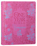 A one-year devotional journaling Bible featuring the NLT translation, pink flower design, and black letter edition.