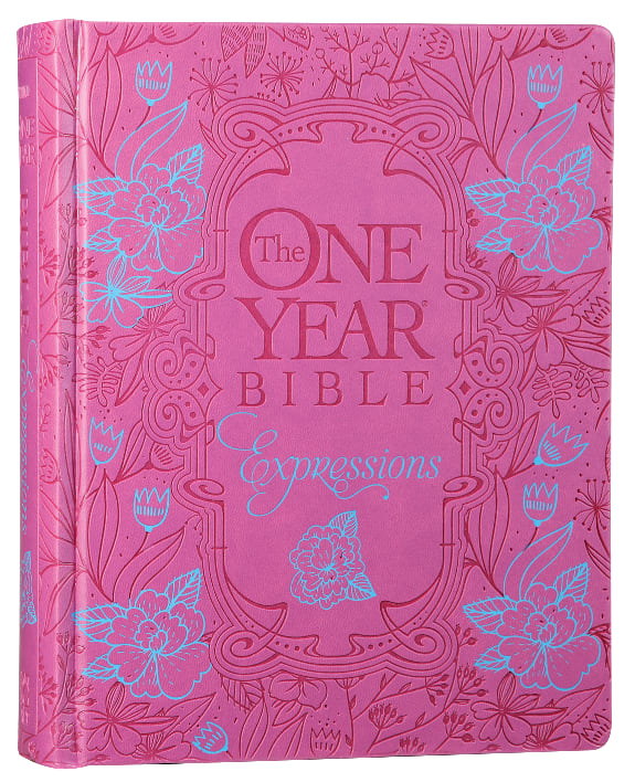 A one-year devotional journaling Bible featuring the NLT translation, pink flower design, and black letter edition.
