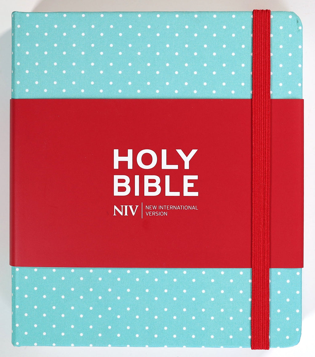 A British edition NIV journaling Bible with a mint polka dot cover and elastic band.