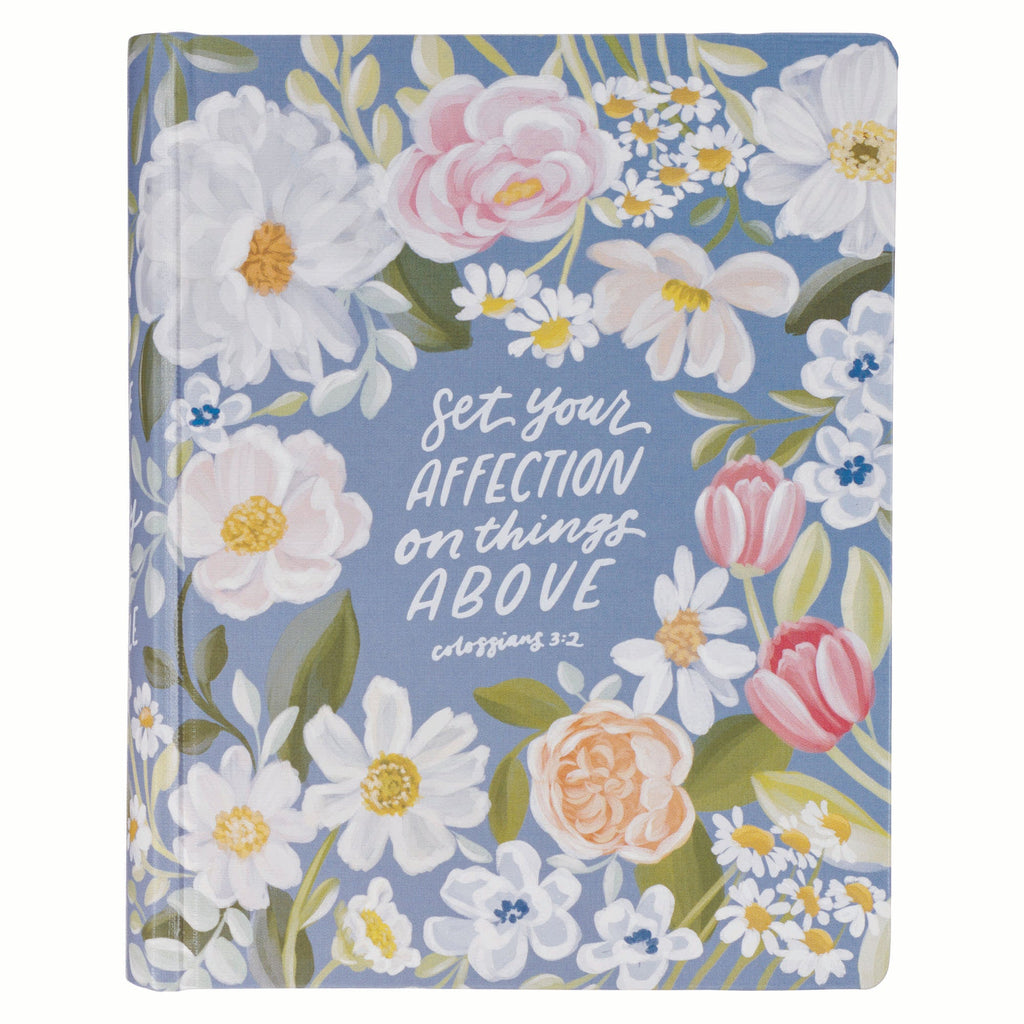 Black letter edition KJV journaling Bible with blue floral cover.