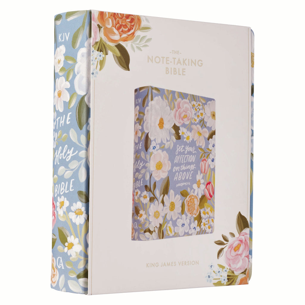 Interior of KJV journaling Bible with black letter text and blue floral cover.