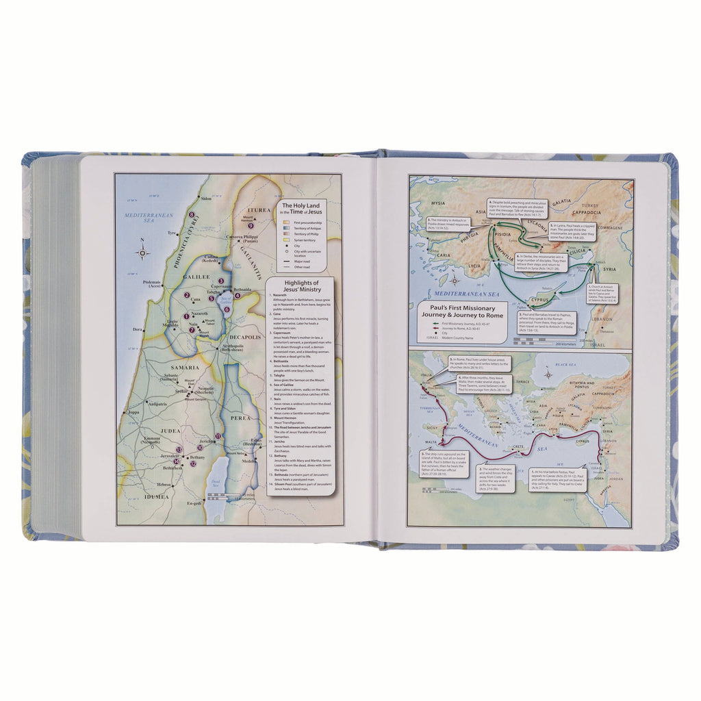 KJV journaling Bible with blue floral cover and black letter text on a bedside table.