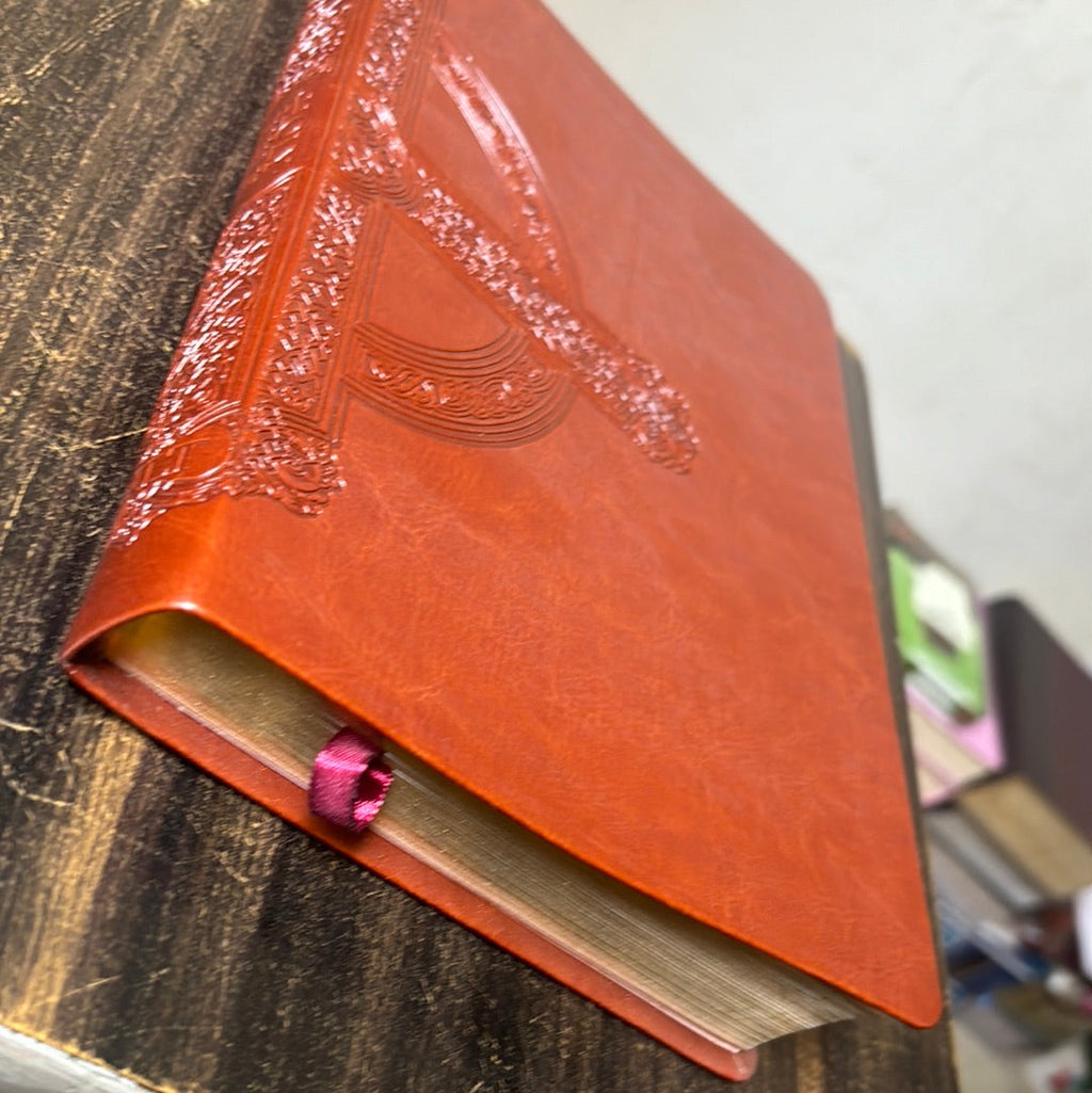 Large Print Cross Leather Bound NLT Bible open to a page with notes