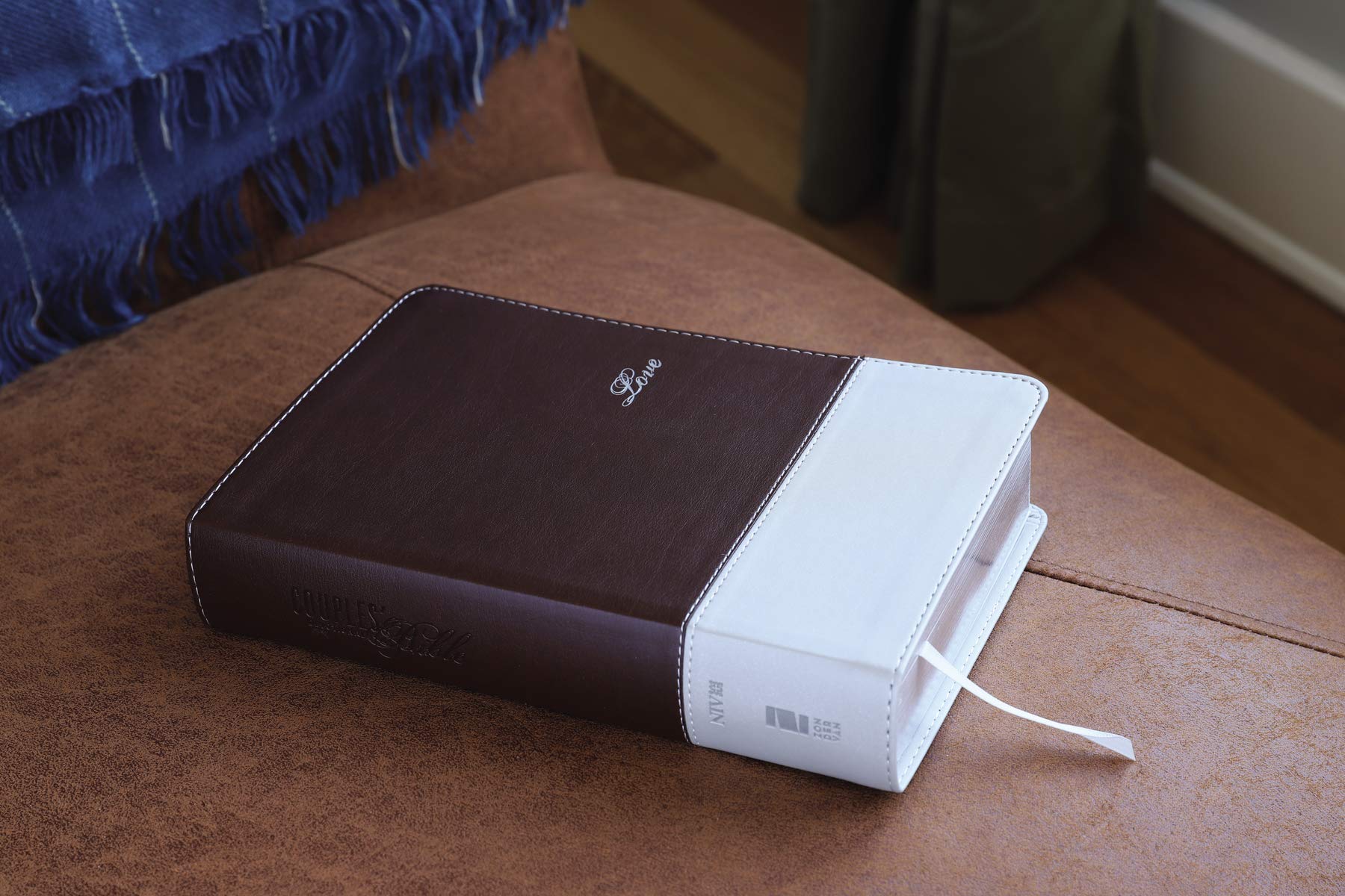 NIV Couples' Devotional Bible, Italian Duo-Tone, Chocolate/Silver, shown on a table.