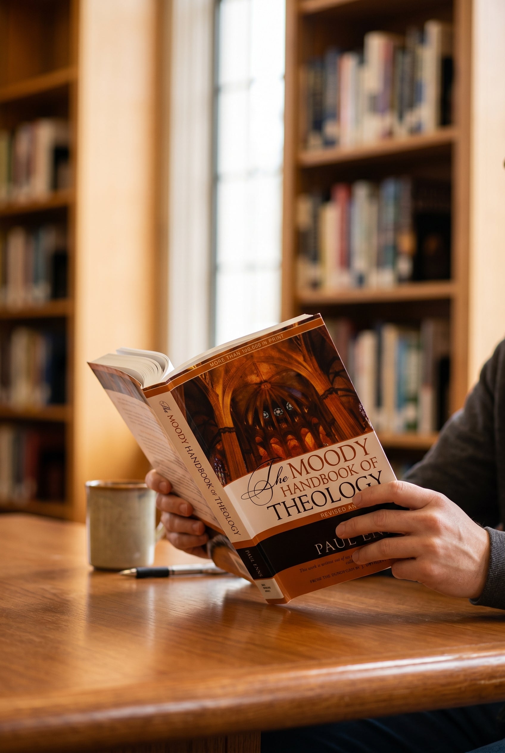 Studio photo of The Moody Handbook of Theology (Revised & Expanded) in lifestyle
