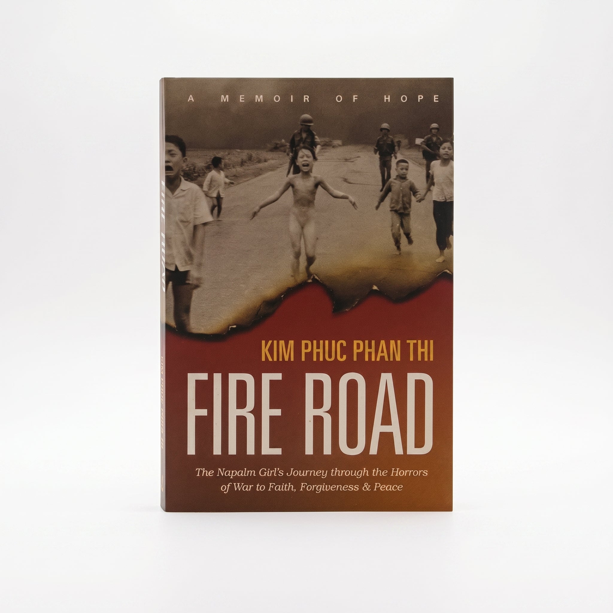Studio photo of Fire Road: The Napalm Girl’s Journey through the Horrors of War to Faith, Forgiveness, and Peace in hero